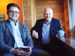 Dustin Fuller (left) the Liberal candidate for the Macleod riding sits with Geoff Regan (right), the Liberal MP (Halifax-West) and natural resources critic at Harvest Coffeehouse in Pincher Creek, Alta. Regan was in town for the informal meeting to talk to residents about the Canadian energy industry. John Stoesser photo/QMI Agency