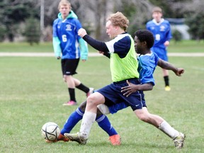 Orlando Campbell (right) of the MDHS senior boys soccer team does some fancy moves around this St. Anne’s defender during midfield play in a 1-0 defeat. ANDY BADER/MITCHELL ADVOCATE