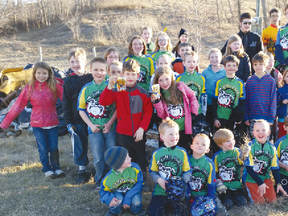 The Portage Junk Yard Dogs kicked off their season with a parent cleanup night on and around Dump Hill last week while the kids took their first ride. (Submitted photo)