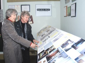 Ruth Grice, left of St. Thomas and Edythe Mugford of St. Mary's look over a special display at Backus Page House Museum last week. The display tributes volunteers with Backus Page and anyone who served on the board of directors. The display will be up until October.