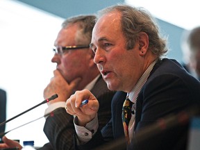 FILE: Ward 8 councillor Ben Henderson, right, who acts as the vice president for the Federation of Canadian Municipalities, speaks during a housing roundtable to call for long-term national funding at City Hall in Edmonton, Alta., on Monday, April 28, 2014. Codie McLachlan/Edmonton Sun