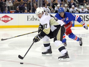 Penguins captain Sidney Crosby skates in on a breakaway past Rangers defenceman Marc Staal and scores during second period action of Game 3 of their second round playoff series in New York on Monday, May 5, 2014. (Brad Penner/USA TODAY Sports)