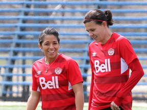 Canadian soccer players Desiree Scott (l) and Christine Sinclair take to the pitch for a practice in Winnipeg, Man. Monday May 05, 2014.
Brian Donogh/Winnipeg Sun/QMI Agency