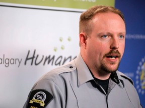 Brad Nichols, manager of animal cruelty investigations for the Calgary Humane Society, announces that charges have been laid in the deaths of a dog and cat in Calgary, Alta., on Monday May 5, 2014. Mike Drew/Calgary Sun/QMI Agency