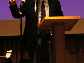 Lawyer Julian Falconer points to a colleague as he speaks to a packed house at the Camlachie Community Centre Monday about challenging the Ontario government's policy for wind turbine construction under the Canadian Charter of Rights and Freedoms. More than 500 people attended the presentation. TYLER KULA/ THE OBSERVER/ QMI AGENCY