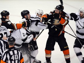 Ducks defenceman Bryan Allen (55) and Kings defenceman Matt Greene (2) are called for minor penalties for their involvement in a post-whistle scrum during first period action in Game 2 of their second round playoff series in Anaheim on Monday, May 5, 2014. (Richard Mackson/USA TODAY Sports)