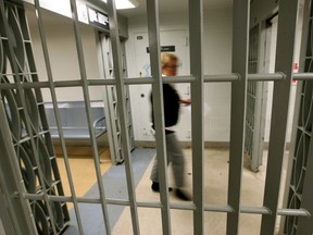 A corrections official walks through the maximum security Edmonton Institution, Jan. 10, 2011. The Federal government announced, Jan. 10, 2011, that the Edmonton Institution is among three federal prisons in Alberta and Saskatchewan that will undergo a $55 million expansion. (DAVID BLOOM/QMI AGENCY FILE PHOTO)