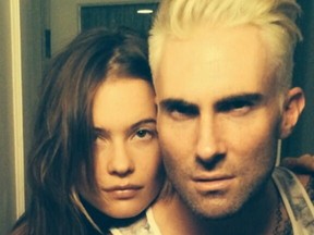 Adam Levine tweeted a photo with fiancee Behati Prinsloo and his new hairdo with the caption: "Apocalypse prep course complete." (twitter.com/adamlevine)