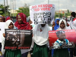 Schoolgirls take part in a protest demanding the release of abducted secondary school girls from the remote village of Chibok, in Lagos May 5, 2014.  (REUTERS/Akintunde Akinleye)
