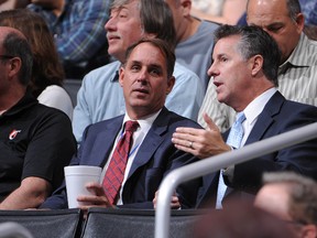 President Andy Roeser and GM/VP of basketball operations Neil Olshey of the Los Angeles Clippers look on during a game against the Memphis Grizzlies at Staples Center on March 24, 2012. (Andrew D. Bernstein/NBAE via Getty Images/AFP)