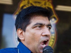 FILE: Balraj Manhas, President of the United Cabbies Association of Edmonton, speaks to a crowd. Cab drivers with Teamsters Local 987 walked off the job in front of the Yellow Cab offices on 31 Avenue in Edmonton, Alberta, on Aug. 13, 2012. Cab drivers with Yellow Cab, Prestige Limos, Barrel Taxi and Checker Cabs were protesting service fees charged for at-fault accidents. IAN KUCERAK/EDMONTON SUN