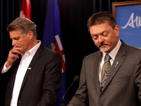 AUPE President Guy Smith and Finance Minister Doug Horner speaks to the media on the amendments to Bill 9 and to Bill 10 along with priviate sectors pension plans at the Alberta Legislature in Edmonton, Alberta on Tuesday, May 6, 2014.  Perry Mah/ Edmonton Sun