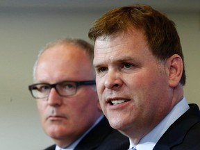 Foreign Minister John Baird (R) takes part in a news conference in Ottawa May 2, 2014. REUTERS/Chris Wattie
