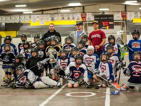 Adrian Sorichetti, Ryan Dilks, and Riley Loewen from the Edmonton Rush lead the practices. Pictured: Vermilion Roar's tyke and novice teams with Edmonton Rush players.