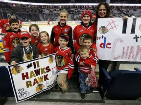 Family of the Portland Winterhawks' Adam De Champlain (from Sherwood Park) cheer him on against the Oil Kings during Game 3 of the WHL finals. (David Bloom, Edmonton Sun)