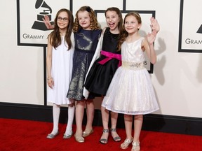 Oona Laurence, Milly Shapiro, Bailey Ryon and Sophia Gennusa, (L-R) the actresses who rotate playing Matilda in the Broadway show "Matilda," arrive together at the 56th annual Grammy Awards in Los Angeles, California January 26, 2014.    REUTERS/Danny Moloshok