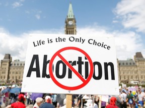 Anti-abortion protesters take part in the National March for Life on Parliament Hill in Ottawa May 9, 2013. REUTERS/Chris Wattie