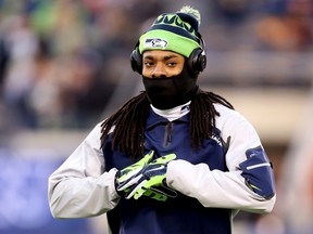 Cornerback Richard Sherman of the Seattle Seahawks warms up before playing against the Denver Broncos during Super Bowl XLVIII at MetLife Stadium on February 2, 2014. (Jeff Gross/Getty Images/AFP)