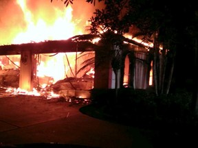 Flames engulf a house owned by former tennis pro James Blake in this handout photograph provided by the Hillsborough Sheriff's Office in Tampa, Florida May 7, 2014. (REUTERS/Hillsborough County Sheriff's Office/Handout via Reuters)