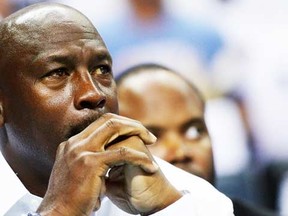 Michael Jordan watches as the Charlotte Bobcats play the Miami Heat in Game 3 of the Eastern Conference quarterfinals during the 2014 NBA Playoffs at Time Warner Cable Arena on April 26, 2014 in Charlotte, North Carolina. (Grant Halverson/Getty Images/AFP)