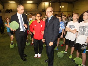 From the left: MLA Kevin Chief, soccer star Desiree Scott, and Mayor Sam Katz at the announcement that a new indoor soccer facility will be built at the Garden City Community Centre. (Chris Procaylo/Winnipeg Sun)