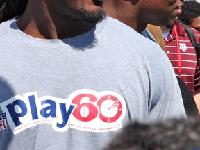 South Carolina defensive end Jadeveon Clowney and University of Buffalo linebacker Khalil Mack attend the NFL PLAY 60 Youth Football Festival at Chelsea Waterside Park in Manhattan, N.Y., on Wednesday, a day before the league's draft. (John Kryk/QMI Agency)