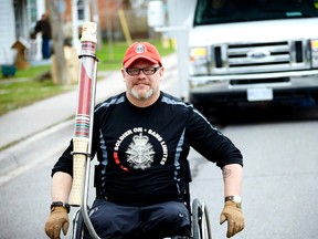 Master Cpl. (retired) Paul Franklin carries the last Canadian Flag to fly at International Security Assistance Force Headquarters in Kabul, Afghanistan.Photo Supplied/Soldier On Canada