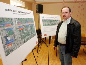 Stan Marciniak, environmental manager at Quinte Gardens in Belleville, checks out proposed infrastructure improvements to Lane Avenue and Donald Street as part of the North East Feedermain Project during a Build Belleville public information session held at the College Street West retirement facility Wednesday evening, May 7, 2014. - Jerome Lessard/The Intelligencer/QMI Agency