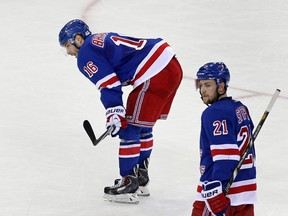 New York Rangers centre Derick Brassard (16) and centre Derek Stepan (21) skate off after losing to the Pittsburgh Penguins in Game 4 of their series. (Adam Hunger-USA TODAY Sports)