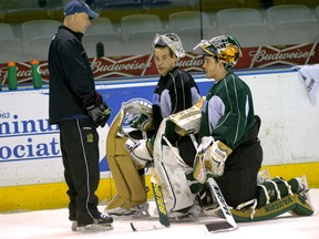 Goaltender coach Bill Dark talks with goalies Anthony Stolarz and Jake Patterson during a practice at Budweiser Gardens. Both goalies have Memorial Cup experience. This time, they?ll be playing on home ice surrounded by fans. Dark says that should be an advantage for the Knights. (MORRIS LAMONT, The London Free Press)