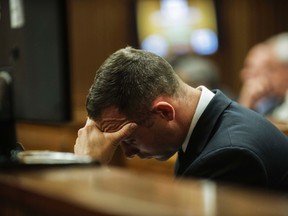 South African Olympic and Paralympic athlete Oscar Pistorius sits in the dock during his murder trial in the North Gauteng High Court in Pretoria May 8, 2014. (REUTERS)