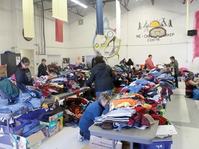 Women sort through the children’s clothes donated to the NeChee Centre from Sudbury during the Big Indoor Sale on Wednesday, May 7.