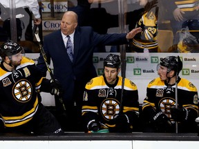 Boston Bruins head coach Claude Julien talks with center Patrice Bergeron (37) during the third period against the Montreal Canadiens in game one of the second round of the 2014 Stanley Cup Playoffs at TD Banknorth Garden on May 1, 2014 in Boston, MA, USA. (Greg M. Cooper/USA TODAY Sports)