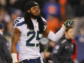 Cornerback Richard Sherman #25 of the Seattle Seahawks walks off the field at the end of the second quarter against the Denver Broncos during Super Bowl XLVIII at MetLife Stadium on February 2, 2014 in East Rutherford, New Jersey. (Kevin C. Cox/Getty Images/AFP)