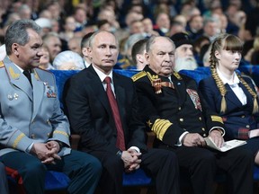 Russian President Vladimir Putin (2nd L, front) and Defence Minister Sergei Shoigu (L) attend a concert dedicated to upcoming Victory Day celebrations in Moscow, May 8, 2014. Russia celebrates victory over Nazi Germany on May 9. (REUTERS/Alexei Nikolsky/RIA Novosti/Kremlin)