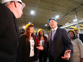 Ontario PC Leader Tim Hudak makes a campaign stop at Automatic Coating Ltd in Scarborough on Tuesday May 6, 2014. Michael Peake/Toronto Sun/QMI Agency