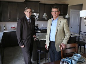 Howard Bogach, left, president and CEO of Tarion Warranty Corporation and Ontario Home Builders’ Association President Eric DenOuden are worried about the rise of illegal home building in Ontario.
ELLIOT FERGUSON/KINGSTON WHIG-STANDARD/QMI AGENCY