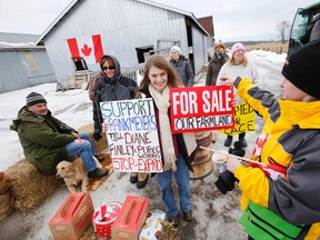 London, Ont. resident Tina Jensen, centre and about a dozen other protesters and activists express their support for Quinte West farmer Frank Meyers in Trenton, Ont. in January 2014. - FILE PHOTO BY JEROME LESSARD/The Intelligencer/QMI Agency