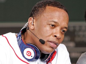 Recording artist Dr. Dre wears a pair of Beats headphones as he attends the MLB 2010 season opener between the New York Yankees and Boston Red Sox at Fenway Park in Boston, in this file photo taken April 4, 2010.  REUTERS/Adam Hunger/Files
