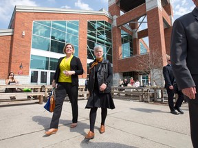 Ontario NDP leader Andrea Horwath walks with London North Centre NDP candidate Judy Bryant after a tour of the Covent Garden Market in London, Ontario on Thursday May 8, 2014. (CRAIG GLOVER, The London Free Press)