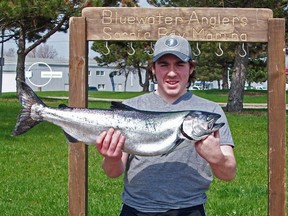 Nick Discano is pictured with the 13.50 lb salmon he caught on day seven of the 38th Annual Bluewater Angler's Salmon Derby. SUBMITTED PHOTO