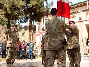 The flag is lowered in Kabul during a ceremony marking the end of Canada’s 12-year military involvement in Afghanistan in March.  (File photo)