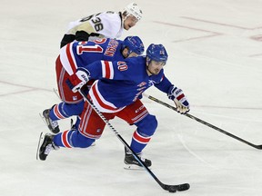 New York Rangers left wing Chris Kreider (20) controls the puck against the Pittsburgh Penguins during the third period of Game 4. (USA Today Sports)