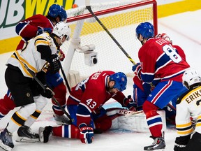 Boston Bruins winger Matt Fraser pokes the puck past Montreal Canadiens goalie Carey Price during Game 4 of their Eastern Conference semifinal series at the Bell Centre in Montreal, May 8, 2014. (PIERRE-PAUL POULIN/QMI Agency)