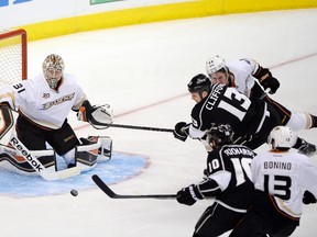 Kings left wing Kyle Clifford (13) takes a shot against Ducks goalie Frederik Andersen during first period action in Game 3 of their second round playoff series in Los Angeles Thursday, May 8, 2014. (Richard Mackson/USA TODAY Sports)
