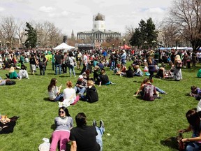 People gather at the 4/20 pro-marijuana rally in Civic Center Park with the capitol building in the background in downtown Denver April 20, 2013.  REUTERS/Rick Wilking