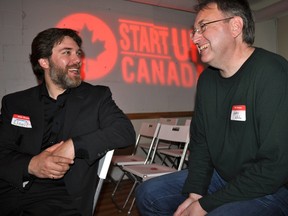 Londoner Joel Adams (left), co-founder of Hacker Studios, and Strathroy resident Gary Will, roving entrepreneur for Communitech, share a laugh at Hacker Studios in London, Ont. May 8, 2014. Both men were recognized among the Ontario winners of the inaugural Startup Canada Awards for outstanding achievement in supporting entrepreneurship. CHRIS MONTANINI\LONDONER\QMI AGENCY