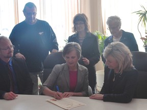 Portage la Prairie councillor Liz Driedger signs a proclamation officially declaring May as MS Awareness Month in Portage la Prairie. With Driedger are (Top L-R): Past chairs Ed Lawrence, Dawn Davis, Mable Brown (Bottom L-R): Darell Homeniuk, Director of client services and government relations for the MS Society, and Donna Boyd, president of the MS Society's Manitoba Division. (Kevin Hirschfield/THE GRAPHIC)