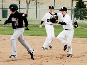 After a great pick-off move by Whitesox pitcher Adam Macko, a teammate runs down an Edmonton baserunner for an out during action in their game on May 3. The Sox provided Macko with plenty of offence as they picked up a 14-4 win on a bitterly cold day.