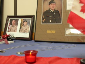 Photographs and dog tags of Cpl. Brent Poland and Pte. William Cushley adorn a table at the Royal Canadian Legion in Sarnia, Ont. Friday, May 9, 2014. Both Lambton County natives were killed during tours of duty in Afghanistan. (BARBARA SIMPSON, The Observer)